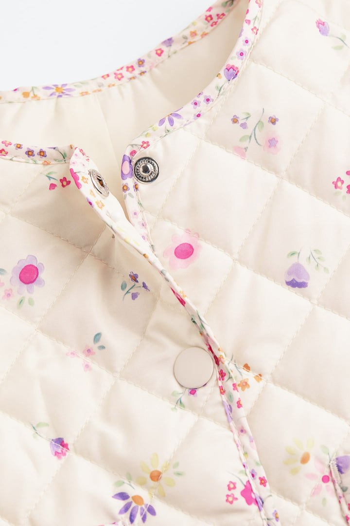 Bērnu stepēta jaka, krēmkrāsas/ziedu raksts